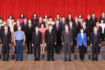 President Xi Jinping (front row, seventh right) is pictured with the new Chief Executive, Mr John Lee (front row, seventh left), and members of the executive, the legislature and the judiciary today (July 1). The Secretary for Labour and Welfare, Mr Chris Sun (third row, fourth left), and the Permanent Secretary for Labour and Welfare, Ms Alice Lau (last row, centre), also attended.