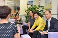 Mrs Lam (second right) and Mr Cheung (first right) chat with service users of Employment in One-stop to understand their difficulty in job search and how they are enhancing their job skills.