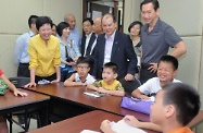 Mrs Lam (first left) and Mr Cheung (third right) visit Tin Shui Wai (North) Integrated Family Service Centre.