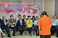 Mrs Lam (fifth left) and Mr Cheung (first left) enjoy a drama show performed by a drama group formed by residents in Tin Shui Wai.