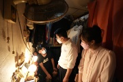 The Secretary for Labour and Welfare, Mr Chris Sun, visited grassroots citizens in Sham Shui Po, before meeting with grassroots families, students, elderly persons and street sleepers this afternoon (July 29). Photo shows Mr Sun (centre), accompanied by the Deputy Director of the Society for Community Organization, Ms Sze Lai-shan (first right), taking a closer look at the living conditions in 