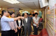 The Chief Secretary for Administration, Mrs Carrie Lam (second left), and the Secretary for Labour and Welfare, Mr Matthew Cheung Kin-chung (fourth left) visit Yau Ma Tei Multi-service Centre for Senior Citizens operated by the Salvation Army.  Picture shows Mrs Lam and Mr Cheung being briefed on the daily operations of the centre.
