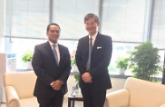 The Secretary for Labour and Welfare, Dr Law Chi-kwong (right) meets the Consul-General of Indonesia in Hong Kong, Mr Tri Tharyat. They exchanged views on Indonesian domestic helpers working in Hong Kong and other mutually interested matters.