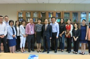Mr Cheung (seventh right) and Ms Carol Yip (seventh left) are pictured with Dr Lum (sixth right) and the research staff of Sau Po Centre on Ageing.