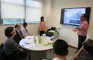 Mr Cheung (second left) and Ms Carol Yip (first left) being briefed by the Director of The Hong Kong Jockey Club Centre for Suicide Research and Prevention, Dr Paul Yip (first right), on the Centre’s research on suicide prevention.