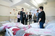 The Secretary for Labour and Welfare, Dr Law Chi-kwong, visited Central and Western District and called at Parkside Residence and Parkside Integrated Service Team operated by St James' Settlement Rehabilitation Services in Sai Ying Pun. Photo shows (from second left) Dr Law; the Chairman of the Central and Western District Council, Mr Yip Wing-shing; and the District Officer (Central and Western), Mrs Susanne Wong, visiting the hostel.