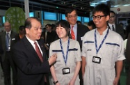 Mr Cheung chats with trainees of the Aircraft Maintenance Craftsman Trainee Training Project.