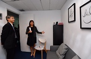 The Secretary for Labour and Welfare, Dr Law Chi-kwong, visited a facility that provides mental health support services and rehabilitation services in Tsuen Wan District. Photo shows Dr Law (left) being briefed by a staff member of Caritas Wellness Link - Tsuen Wan on the centre's services and facilities.