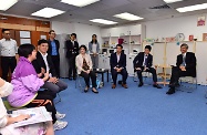 The Secretary for Labour and Welfare, Dr Law Chi-kwong, visited a facility that provides mental health support services and rehabilitation services in Tsuen Wan District. Photo shows Dr Law (first right) exchanging views with staff of Caritas Wellness Link - Tsuen Wan and peer support workers, as well as family members, friends and carers of service users, in order to gain a better understanding of their opinions and needs.