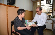 The Secretary for Labour and Welfare, Mr Matthew Cheung Kin-chung (right), visited a privately run elderly home in Sham Shui Po this morning. He distributed cleaning and disinfection packs to the elderly residents and reminded them of the importance of personal and environmental hygiene.