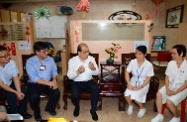 Mr Cheung (third left) meets with staff of the elderly home to understand their daily operations and the challenges they face.