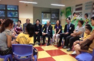 The Secretary for Labour and Welfare, Mr Matthew Cheung Kin-chung, officiated at the launching of an after-school counselling programme organised by the Hong Kong and Macao Lions Beacon for Youth Foundation this afternoon (October 4). Picture shows Mr Cheung (seventh right) chatting with children participating in the programme and their parents after the ceremony.