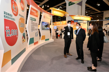 The Secretary for Labour and Welfare, Mr Chris Sun, attended a forum on 'Tech-enhanced Social Care - the Way Ahead after the Pandemic' this morning (November 4) at the Gerontech and Innovation Expo cum Summit 2022 jointly hosted by the Government and the Hong Kong Council of Social Service. Photo shows Mr Sun (second left) being briefed by colleagues of the Social Welfare Department (SWD) at the Innovation and Technology Fund for Application in Elderly and Rehabilitation Care exhibition area of the SWD on how the fund improves the quality of life of service users as well as reduces the burden and pressure of care staff and carers.