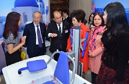 The Secretary for Labour and Welfare, Mr Matthew Cheung Kin-chung, today attended the opening ceremony of Po Leung Kuk Wan Chai Home for the Elderly cum Day Care Centre for the Elderly. Photo shows a staff member briefing Mr Cheung (third left); the Chairman of Po Leung Kuk, Dr Eleanor Kwok (fourth left) and other guests on the home's facilities.