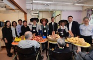 The Secretary for Labour and Welfare, Dr Law Chi-kwong, visited Tai Po District and elderly residents in TWGHs Pao Siu Loong Care & Attention Home. Photo shows Dr Law (back row, fourth right); the Under Secretary for Labour and Welfare, Mr Caspar Tsui (back row, second right); the Community Services Secretary of the Tung Wah Group of Hospitals, Dr Ivan Yiu (back row, first right); the District Social Welfare Officer (Tai Po/North), Mr Yam Mun-ho (back row, third left); and the District Officer (Tai Po), Ms Andy Lui (back row, fourth left), joining elderly people in a simulated bazaar in the institution. Elderly residents with dementia can take a stroll down memory lane and maintain their memory through bazaar activities.
