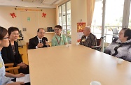 The Secretary for Labour and Welfare, Mr Matthew Cheung Kin-chung, visited Sha Tin District and toured Caritas Jockey Club Integrated Day Services Centre for the Elderly, which is actively participating in the second phase of the Pilot Scheme on Community Care Service Voucher for the Elderly launched by the Social Welfare Department. Photo shows Mr Cheung (third left) and District Social Welfare Officer (Sha Tin), Mrs Gloria Lee (second left), exchanging views with some day care service users.