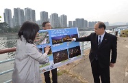 The Secretary for Labour and Welfare, Mr Matthew Cheung Kin-chung, visited Sha Tin District and viewed the site of the Signature Project Scheme (Sha Tin District) - Revitalisation of Shing Mun River Promenade near Sha Tin Town Centre. Photo shows District Officer (Sha Tin), Miss Amy Chan (left), briefing Mr Cheung (right) on how Shing Mun River Promenade would be revitalised to enhance public enjoyment.