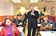 The Secretary for Labour and Welfare, Dr Law Chi-kwong, visited Caritas Cheng Shing Fung District Elderly Centre (Sham Shui Po). Photo shows Dr Law (centre) singing the song "The Beacon of Friendship" with elderly volunteers.