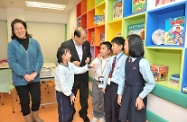 Mr Cheung chats with the children participating in the after-school care programme offered by the centre.