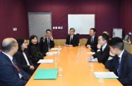 The Secretary for Labour and Welfare, Dr Law Chi-kwong, visited the Working Family Allowance Office for an update on the improved Working Family Allowance Scheme to be implemented on April 1. Photo shows Dr Law (centre) and the Under Secretary for Labour and Welfare, Mr Caspar Tsui (sixth left), being briefed by the Head of the Working Family and Student Financial Assistance Agency, Mr Esmond Lee (fourth left), on staff preparedness for the scheme's improvement measures.