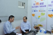 The Secretary for Labour and Welfare, Mr Matthew Cheung Kin-chung (right), visited the Hotmeal Canteen in Sham Shui Po today (September 6) to see the operation and services of the community canteen. Picture shows Mr Cheung being briefed by the Chief Executive Officer of the Baptist Oi Kwan Social Services, Mr Tsang Wing-keung (left), on the services offered by the Hotmeal Canteen.