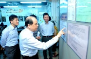 Mr Cheung (middle) is briefed by Mr Tsang (right) on the services offered by the Hotmeal Canteen.