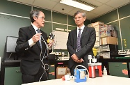 The Secretary for Labour and Welfare, Dr Law Chi-kwong, visited the Labour Department Headquarters to take a closer look at its work. Photo shows Dr Law (right) watching an occupational hygienist demonstrating the use of different instruments to assess the hazards affecting employees' health in the workplace.