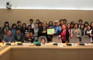 Mr Cheung (seventh right, front row) receiving the position paper on LIFA from the Alliance for Protection of Low-income Families.