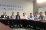 The Secretary for Labour and Welfare, Mr Matthew Cheung Kin-chung (second left), and Assistant Director of Social Welfare Department, Mr Lam Ka-tai (first left), meet with a number of Legislative Council members and representatives/parents of persons with disabilities to hear their views on the provision of day services for adults with disabilities.