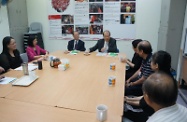 Mr Cheung (fourth left) chats with volunteers.