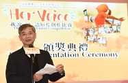 Secretary for Labour and Welfare, Dr Law Chi-kwong, presents prizes to winners of the "Her Voice" Video Competition co-organised by the Labour and Welfare Bureau and the Women's Commission (WoC) to promote the Convention on the Elimination of All Forms of Discrimination against Women of the United Nations among secondary school students before the WoC's reception to celebrate International Women's Day 2018.