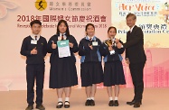 Secretary for Labour and Welfare, Dr Law Chi-kwong, presents prizes to winners of the "Her Voice" Video Competition co-organised by the Labour and Welfare Bureau and the Women's Commission (WoC) to promote the Convention on the Elimination of All Forms of Discrimination against Women of the United Nations among secondary school students before the WoC's reception to celebrate International Women's Day 2018.