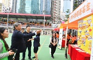The Secretary for Labour and Welfare, Dr Law Chi-kwong, attended "Home, Power" carnival of 2018 Mental Health Month at MacPherson Playground in Mong Kok. Photo shows Dr Law (second left) participating in a carnival booth game.