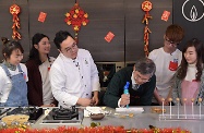 The Secretary for Labour and Welfare, Dr Law Chi-kwong, visited M21 Kitchen of the Hong Kong Federation of Youth Groups and took part in video-shooting for its "Neighbourhood First" programme. Photo shows Dr Law (third right) preparing dessert with care.