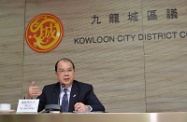 Mr Cheung introduces the Government's labour and welfare policies to the Kowloon City District Council.