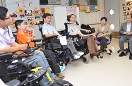 The Chief Secretary for Administration, Mrs Carrie Lam (second right), and the Secretary for Labour and Welfare, Mr Matthew Cheung Kin-chung (right), visit the Direction Association for the Handicapped. Picture shows Mrs Lam and Mr Cheung exchanging views with the Executive Committee members.