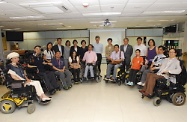 The Chief Secretary for Administration, Mrs Carrie Lam (back row, fourth right), and the Secretary for Labour and Welfare, Mr Matthew Cheung Kin-chung (back row, third right), pictured with the Executive Committee members and staff of the Direction Association for the Handicapped during their visit.