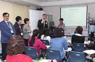 The Secretary for Labour and Welfare, Dr Law Chi-kwong, visited Wong Tai Sin District and visited the Human Resources Training Centre of Hong Kong Employment Development Service. Photo shows Dr Law (second right) observing trainees attending a course on elderly care.