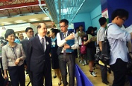 Accompanied by Mrs Patricia Ling (first left) and Mr Yip (second left), Mr Cheung (third left) tours the Summer Job Expo.