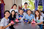 The Secretary for Labour and Welfare, Dr Law Chi-kwong, attended the launch ceremony of "Disney Friends for Change Youth Grant" jointly organised by the Hong Kong Disneyland Resort (HKDL) and the Hong Kong Federation of Youth Groups at HKDL and celebrated HKDL's 12th anniversary. Dr Law (front row, centre) wrote greetings on Mickey Mouse's caps with the Managing Director of HKDL, Mr Samuel Lau (front row, second right); and youth volunteers.