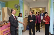 Mr Cheung (third left) is briefed by staff on the services the Home provides for the elderly residents. Mr Cheung is accompanied by the Deputy Chief Executive of the Hong Kong Young Women's Christian Association, Ms Lai Sau-ling (first right); Service Director (Elderly Service and YWCA Movement), Mr Silas Poon (first left); and Assistant District Social Welfare Officer (Central Western, Southern and Islands), Ms Maggie Leung (third right).