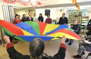 Mr Cheung (second right) joins elderly residents in a physical exercise session.