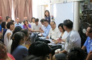 The Secretary for Labour and Welfare, Mr Matthew Cheung Kin-chung (fourth right), meets representatives of various grassroots groups to listen to their views and the difficulties they face in daily life.  He also takes the opportunity to explain to the groups the government policy directives.