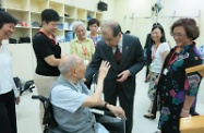 The Secretary for Labour and Welfare, Mr Matthew Cheung Kin-chung, visited two care and attention homes run by the Asia Women's League Limited (AWL). Picture shows Mr Cheung (third right) chatting with an elderly resident at one of the care and attention homes. On first right and fifth right are respectively AWL's Permanent President, Mrs Chan Chan Sau-ying, and its Chairman, Mrs Fok Tsang Shou-ying.
