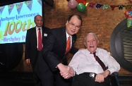 The Secretary for Labour and Welfare, Mr Matthew Cheung Kin-chung, attends the 100th birthday party of veteran journalist Anthony Lawrence who has contributed greatly to the society not only on the journalistic front but also in the community service sphere. Mr Lawrence has been awarded Bronze Bauhinia Star by the Hong Kong SAR Government this year for his long and dedicated community service with the International Social Services Hong Kong Branch. Picture shows Mr Cheung (left) congratulating Mr Lawrence.