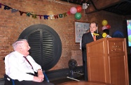 Mr Cheung reads out a congratulation letter for Mr Lawrence from the Chief Executive, Mr CY Leung, during the celebration ceremony.