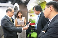 The Secretary for Labour and Welfare, Mr Matthew Cheung Kin-chung, visited the Youth Employment Start (Y.E.S.) in Kwai Fong. Picture shows Mr Cheung (first left); the Commissioner for Labour, Mr Donald Tong (first right); and the Deputy Commissioner for Labour (Labour Administration), Mr Byron Ng (second right), touring the Y.E.S. Business Members' Corner to see how registered members make use of the free facilities to print promotional materials.