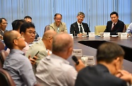 The Secretary for Labour and Welfare, Dr Law Chi-kwong, visited Sai Kung District. Photo shows Dr Law (back row, second right), and the Under Secretary for Labour and Welfare, Mr Caspar Tsui (back row, first right), meeting with the Chairman of the Sai Kung District Council, Mr George Ng (back row, third right), and members to discuss labour and welfare matters.