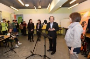 Mr Cheung (second right) participates in a voice recording session by youngsters in the Choi Wan Rhenish Integrated Children and Youth Services Centre.