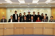Mr Cheung (front row, fourth right) meets with the Chairman of the Wong Tai Sin District Council, Mr Li Tak-hong (front row, fourth left), and other District Council members to exchange views on local needs and concerns.